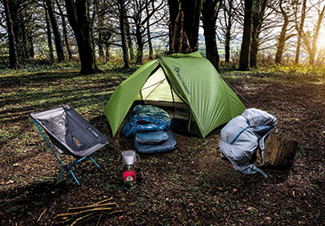 a lightweight tent pitched in a forest